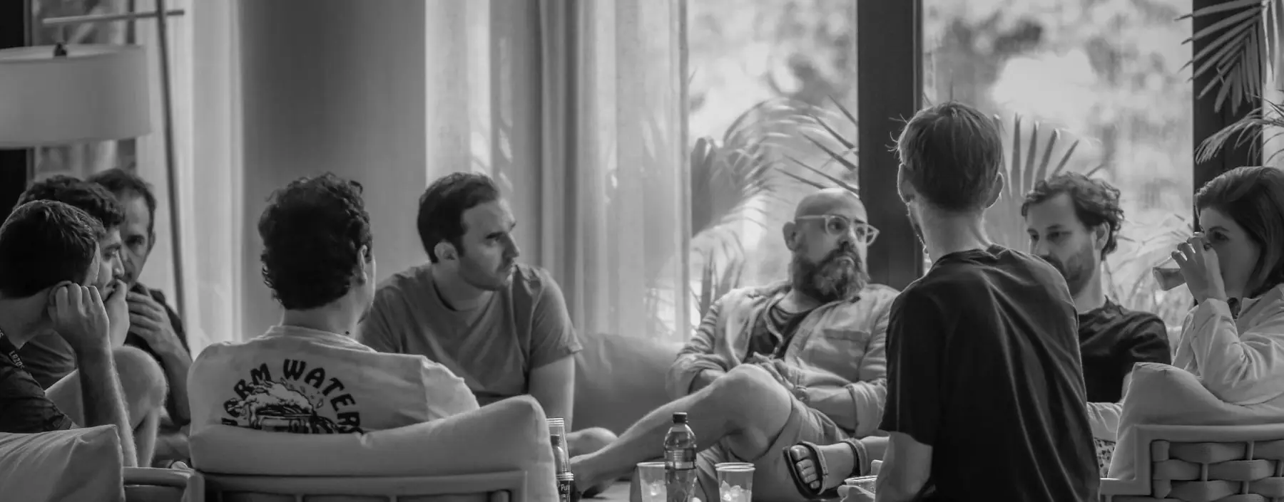 Víctor Estrugo listening in a group conversation